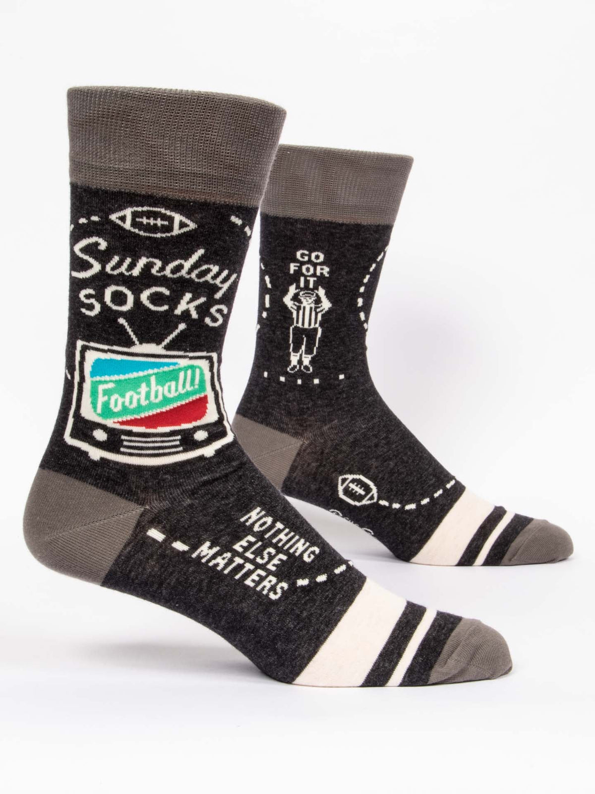 The Blue Q Sunday M-Crew Socks feature football-themed designs and fun phrases like “Sunday Socks” and “Go For It.” With footballs and referees, these gray socks keep feet cozy—perfect for game day with your favorite sweatpants!.