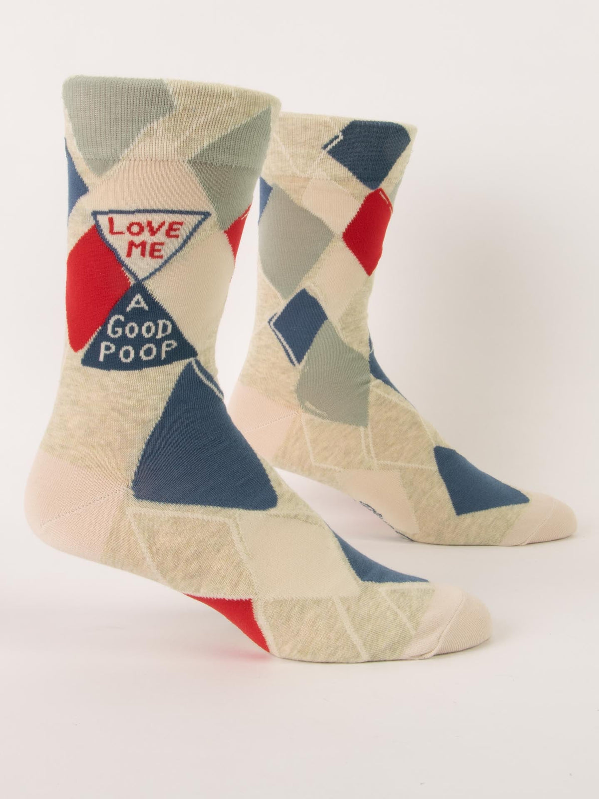 Blue Q’s Love Me A Good Poop M-Crew Socks feature a geometric pattern in blue, cream, red, and gray, made from soft combed cotton with a side patch that reads "LOVE ME A GOOD POOP.