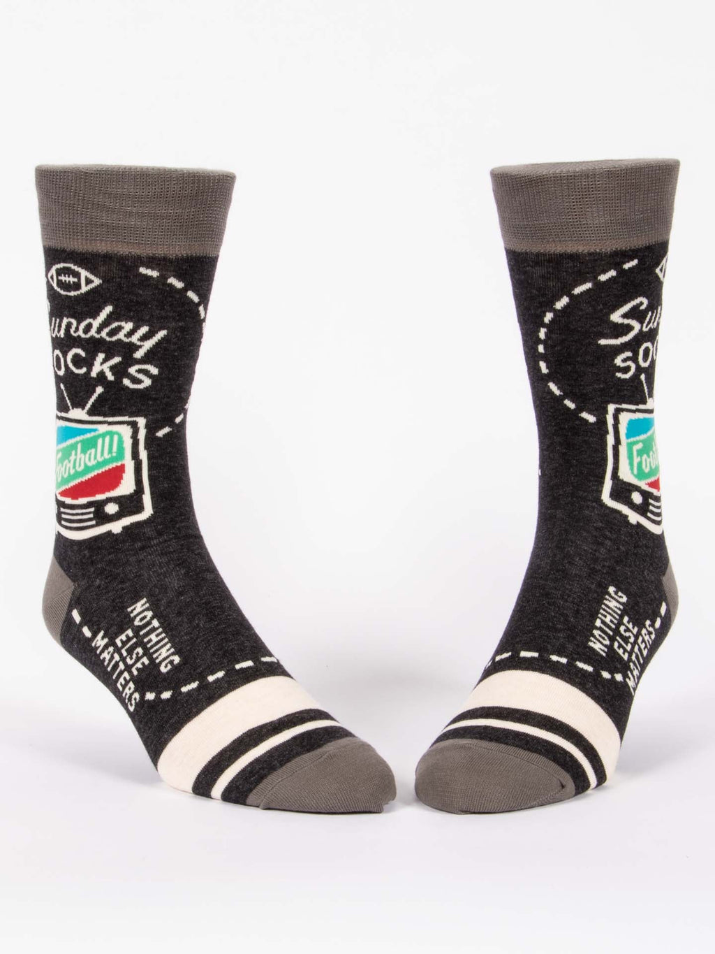 Blue Q’s Sunday M-Crew Socks feature black and gray colors, “Sunday Socks” and “Nothing Else Matters” text, football and TV graphics, plus striped toes and cuffs—perfect for keeping feet warm or gifting.