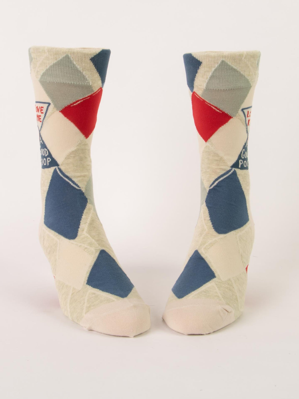 The Blue Q Love Me A Good Poop M-Crew Socks feature a fun geometric design in cream, blue, gray, and red, made from soft combed cotton and shown upright against a plain white background.