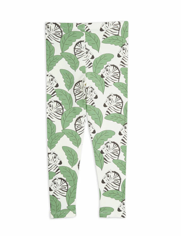 Leggings with a green leaf and zebra pattern on a white background