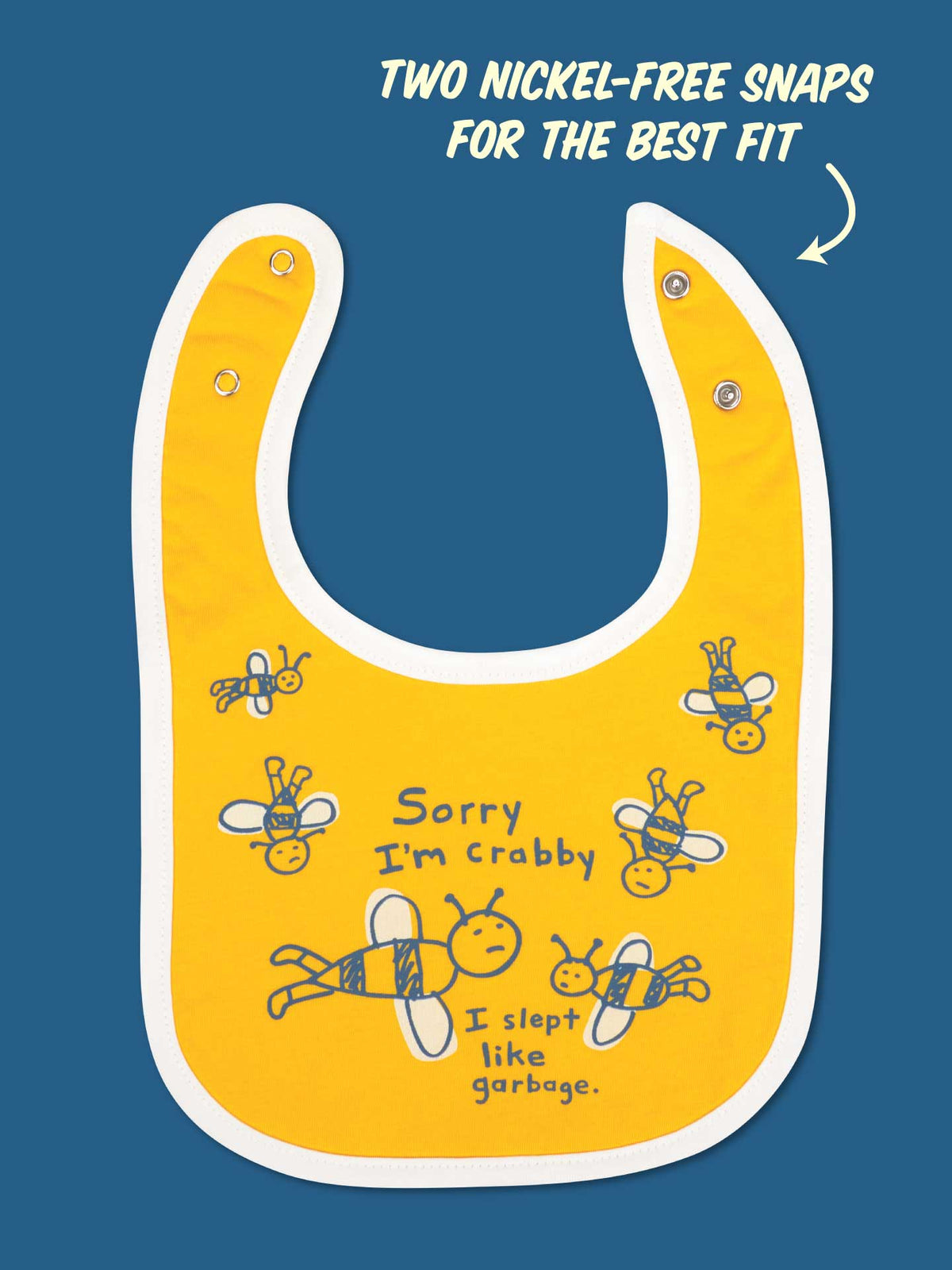 The Blue Q "Sorry I’m Crabby. I Slept Like Garbage." Lunch Chucker Bib is a yellow cotton baby bib with white trim, cartoon bees, two nickel-free snaps for adjustable fit, and an absorbent design for both cuteness and practicality.