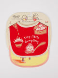 Blue Q’s Tiny Little Dumpling/Wanna Join Me For A Meltdown? Baby Bibs set includes two absorbent bibs: a red cotton bib with a dumpling and "tiny little dumpling" text, and a yellow bib featuring a dumpling character with legs and sauce.