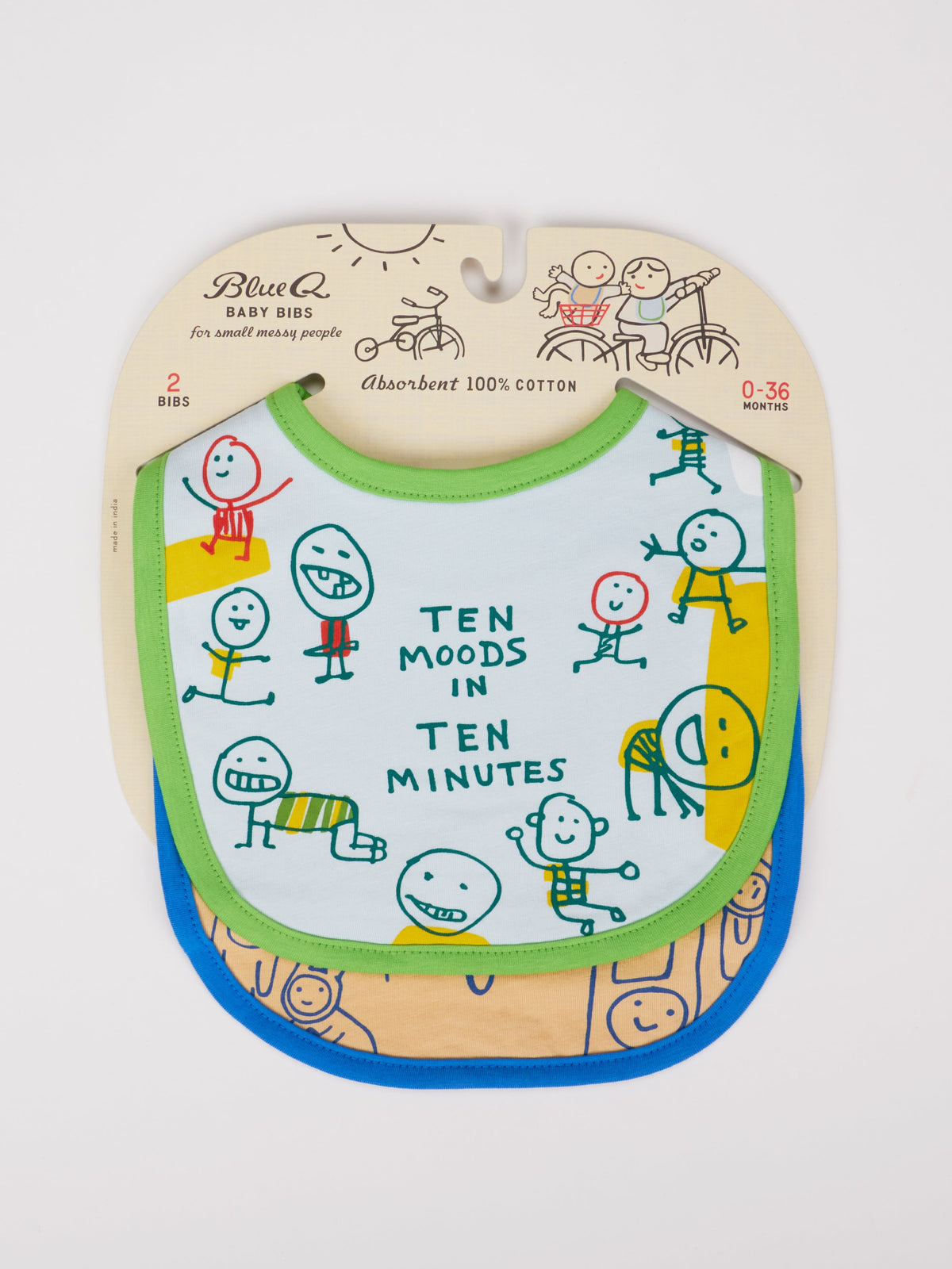 Two absorbent Blue Q baby bibs in packaging: "Ten Moods In Ten Minutes" with playful cartoon faces, and "Finding My Voice." 100% cotton, for ages 0-36 months.