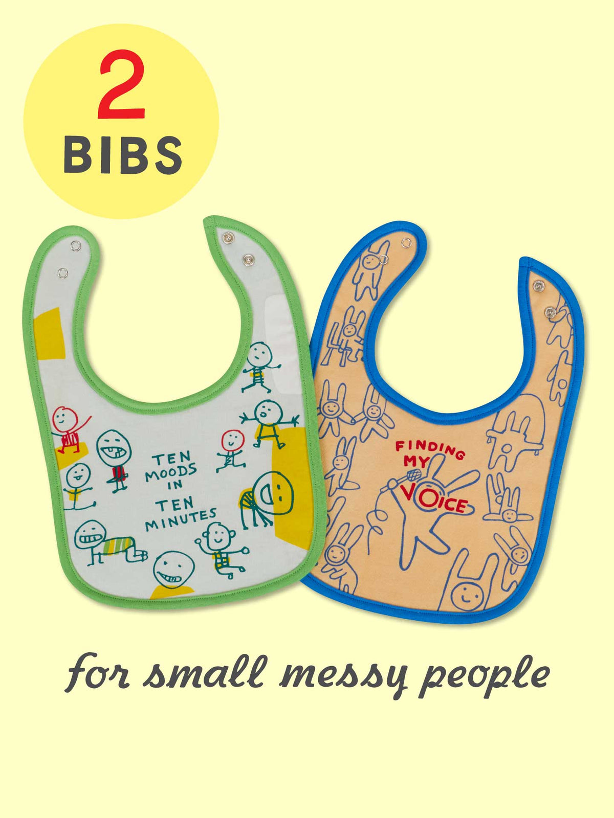 Blue Q’s “Ten Moods In Ten Minutes/Finding My Voice” baby bibs set features two soft, absorbent cotton terry bibs with playful cartoon designs—perfect for messy little ones. Text above reads "2 BIBS.
