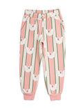 Pink jogger pants with white duck pattern on a white background