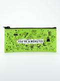 The Blue Q "You're A Monster Pencil Case" is a green zippered pouch with black cartoon monster drawings and bold white "YOU'RE A MONSTER" text—perfect for organizing your supplies.