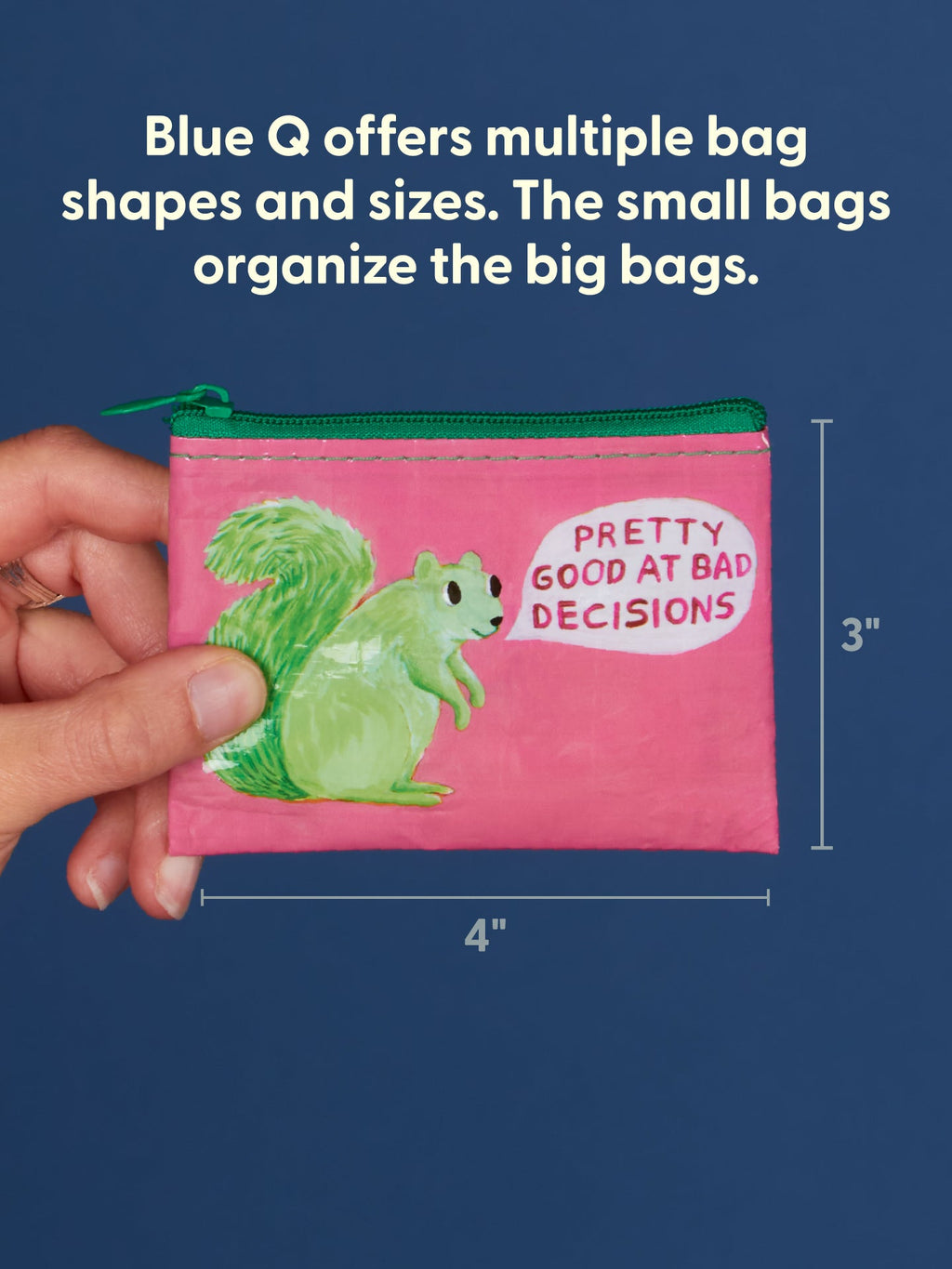 A hand holds the Pretty Good At Bad Decisions Coin Purse by Blue Q—a small pink zip bag featuring a playful green squirrel and the phrase “Pretty Good at Bad Decisions.” Measuring 3 by 4 inches, this purse is perfect for keeping motherly advice or reminders from your personal development journey. Blue Q offers bags like this in a variety of shapes and sizes.
