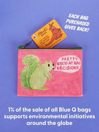 A cheerful pink coin purse from Blue Q, adorned with a green squirrel and the phrase “Pretty Good At Bad Decisions.” Each purchase of this Pretty Good At Bad Decisions Coin Purse supports global environmental initiatives—proof that personal growth can begin with a smile (and perhaps some motherly wisdom).