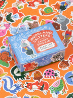 A blue box of Woodland Critters Caught Smokin’ Playtime Sticker Set featuring various innocent critters, all depicted with cigarettes.
