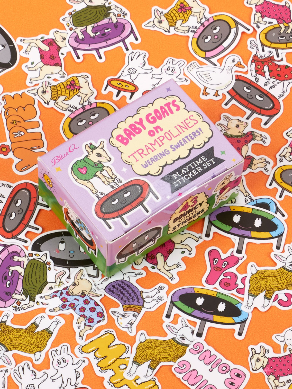A square box for the Baby Goats On Trampolines Wearing Sweaters Playtime Sticker Set, featuring a goat doing a backflip, surrounded by toy stickers of goats, geese, and trampolines on an orange background.